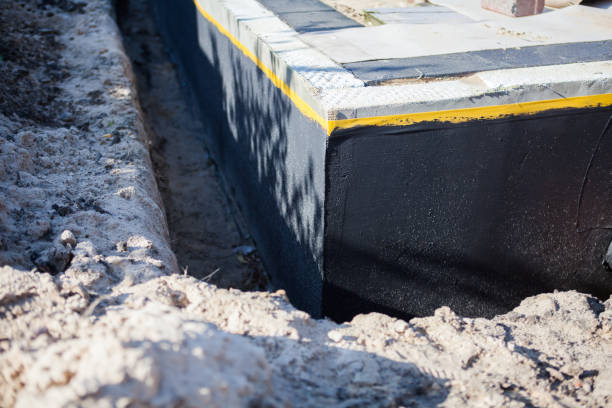 Professional Waterproofing technician working in Athens, OH